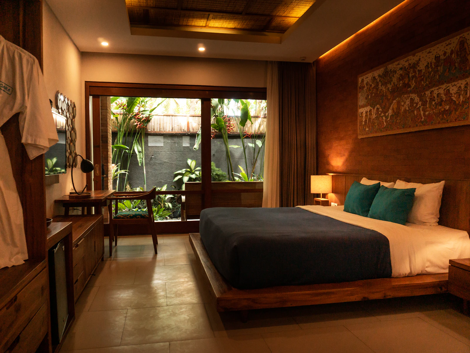 A single room, made up, with the window light behind